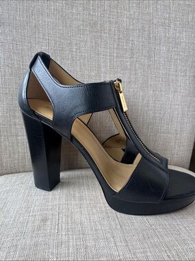 MICHAEL Michael Kors Black Leather T‑Strap Heels with Gold Zip